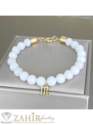  Красива ръчно изработена гривна от бял седеф 8 мм и висулка стоманен зодиакален знак, позлатени стоманени накрайци  - MGA1692